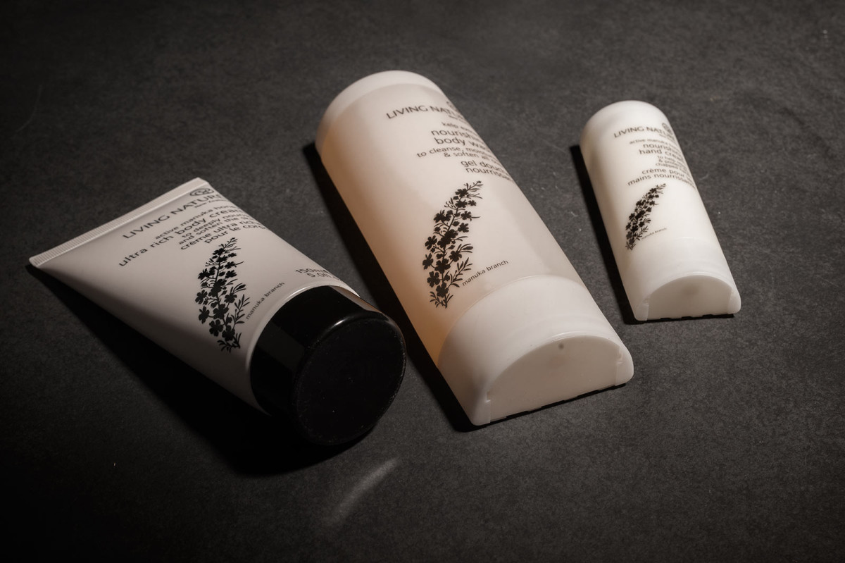 Three Living Nature beauty products are displayed flat without their boxes