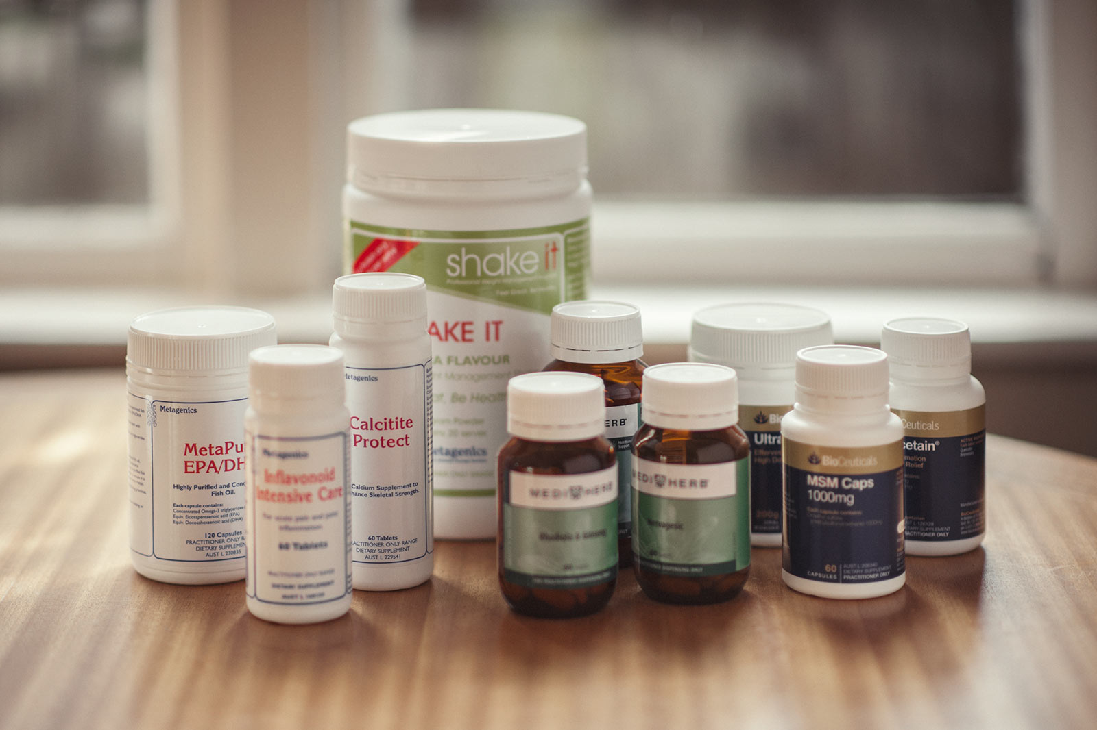 Many various supplements are displayed on a table to show what you can take for sports injury