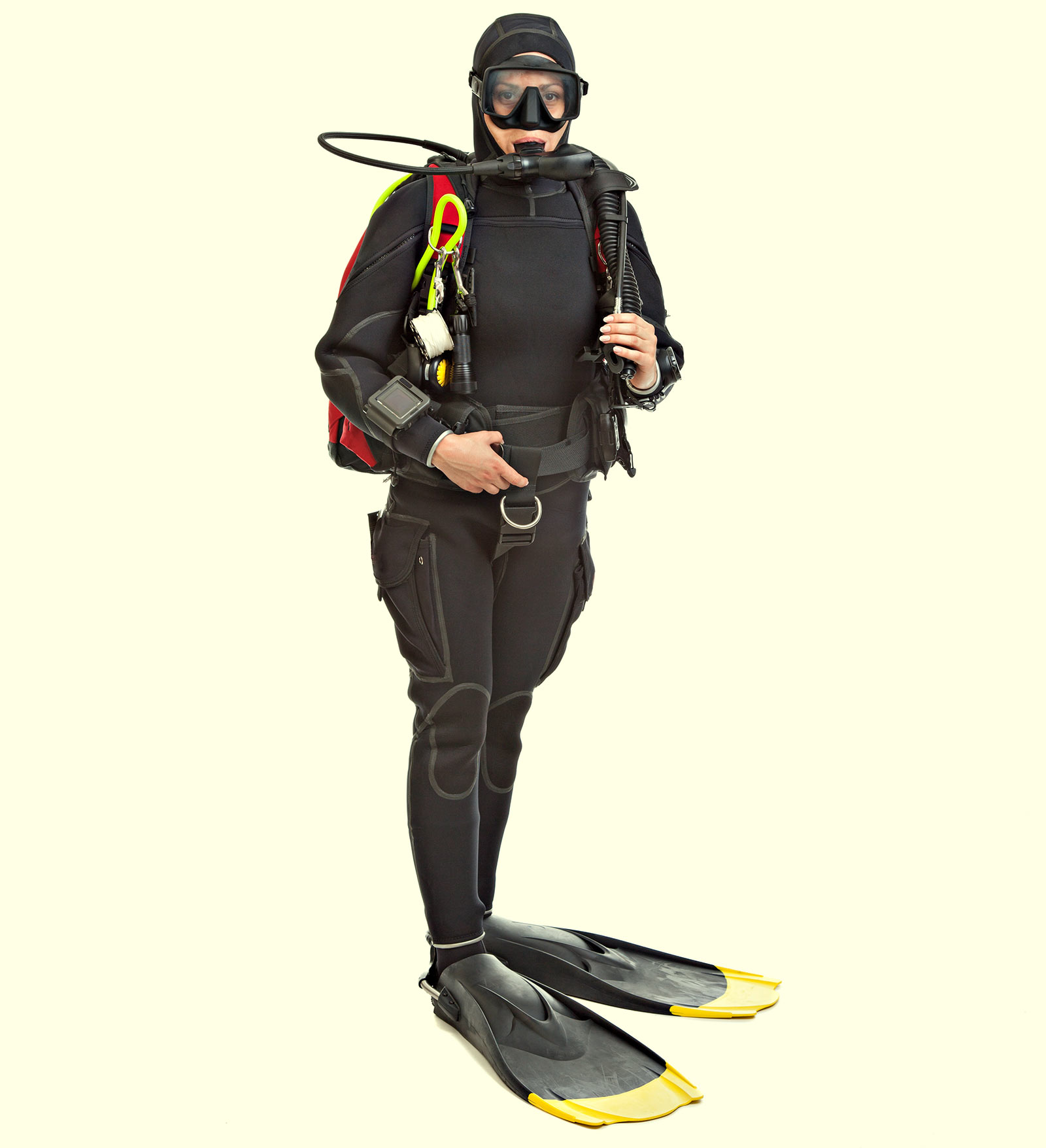 A scuba diver in full entire standing on land