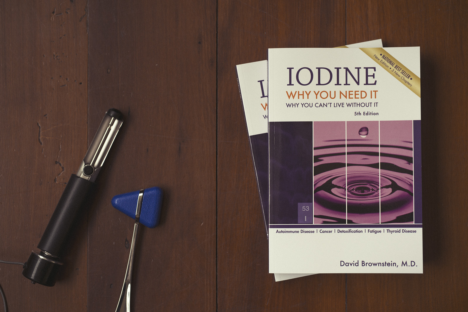 Two copies of Dr Brownstein's wonderful book on iodine deficiency sits on a table