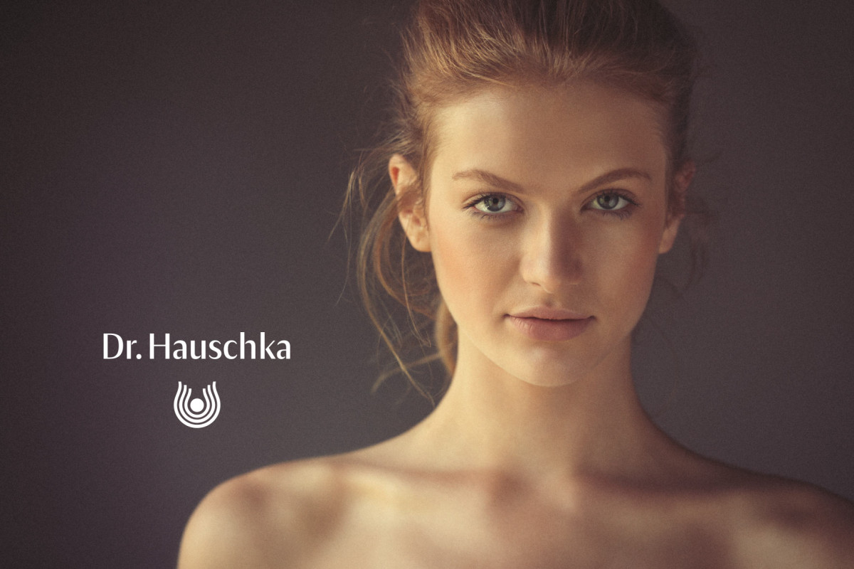 An advert of a pretty young girl to promote Dr Hauschka products