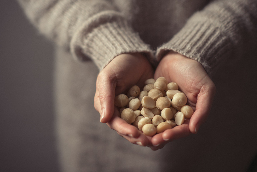 Naturopath Lisa Fitzgibbon holds out macadamia nuts in her hands