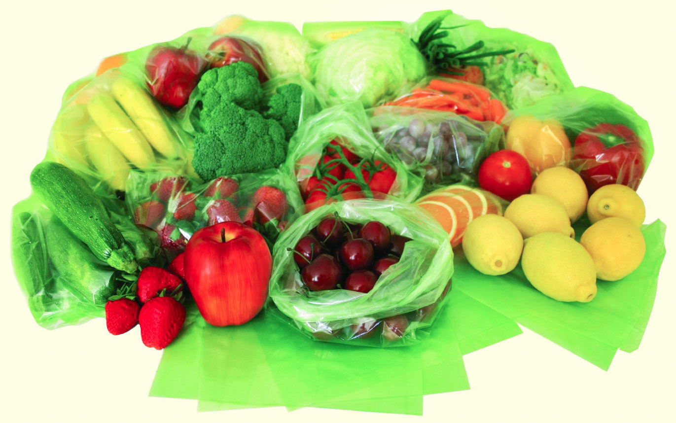 An array of various different fruits and veggies in Evert-Fresh Green Bags