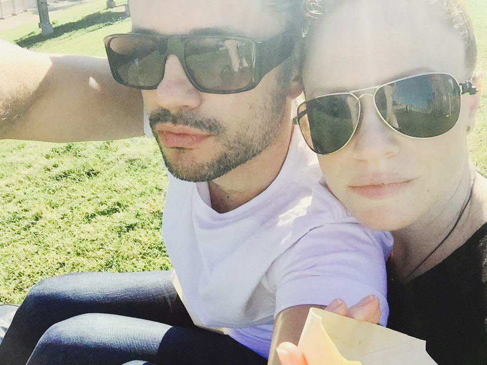 Naturopath Lisa Fitzgibbon and her partner wearing sunglasses and in a healthy romantic relationship